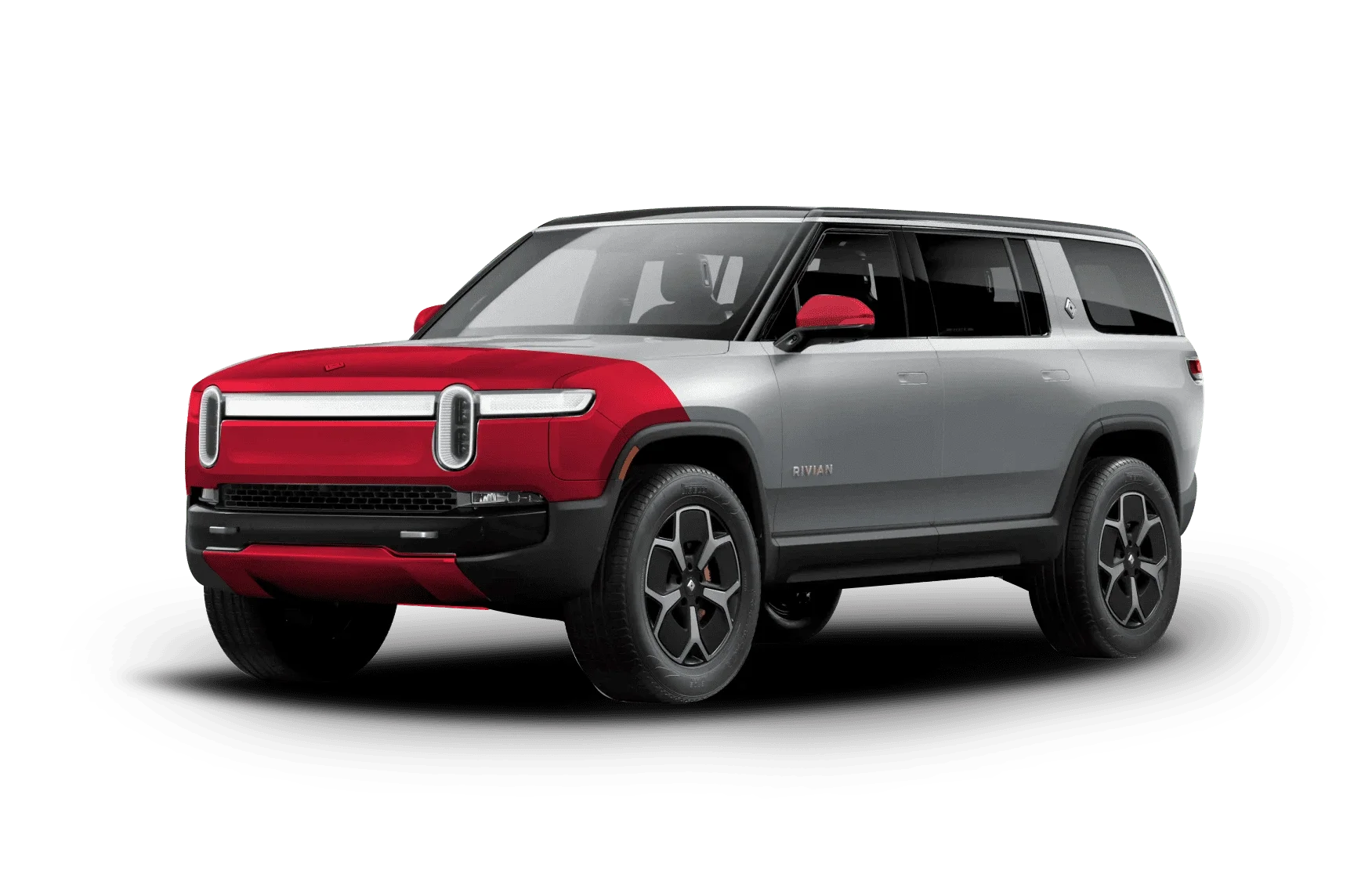 A gray Rivian SUV with a red wrap covering the hood, front bumper, and side mirrors.