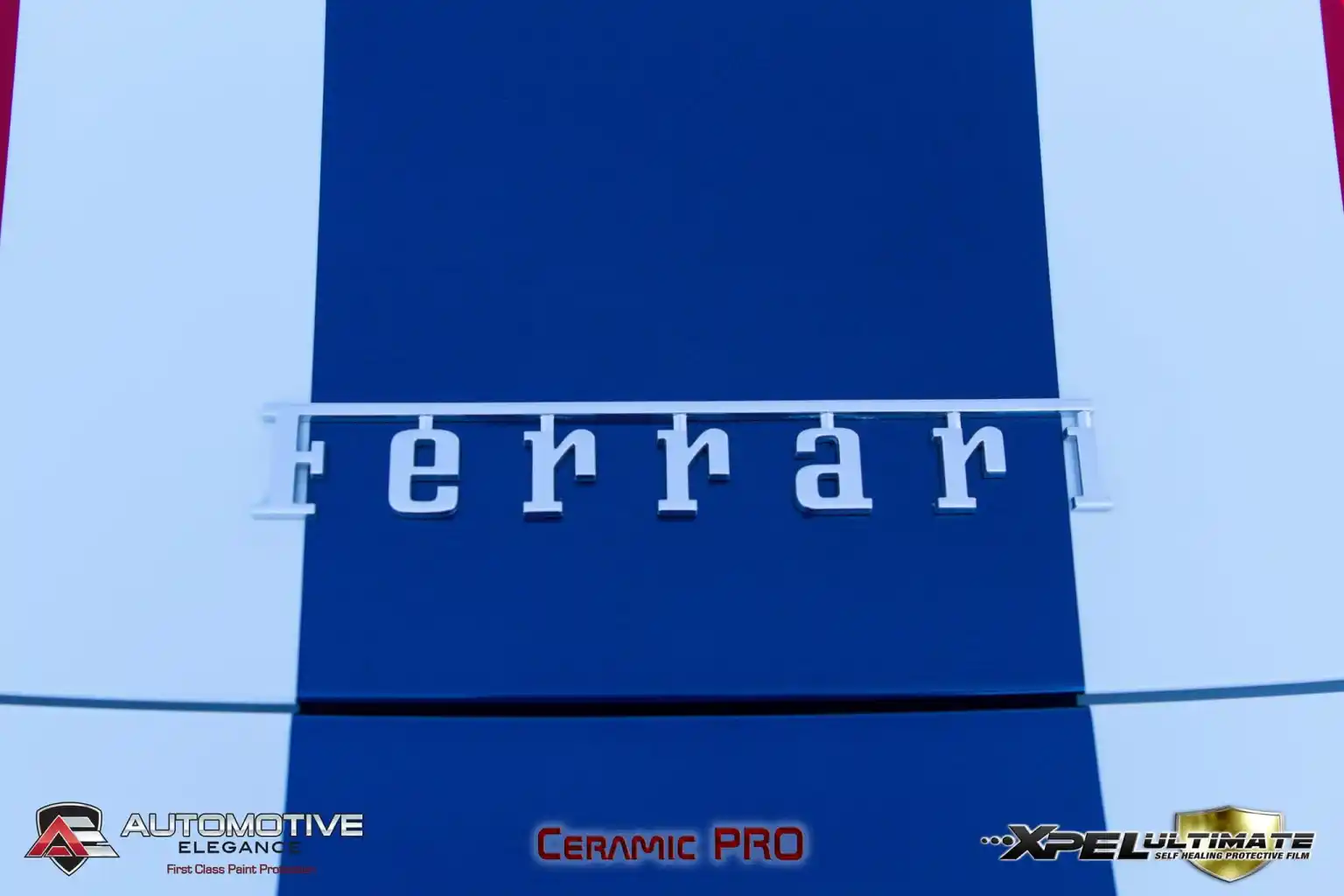 Close-up of Ferrari lettering on the hood racing stripe