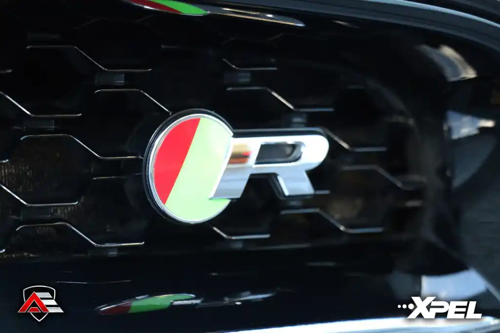 Close-up of Jaguar F-TYPE badge beside the rear taillight