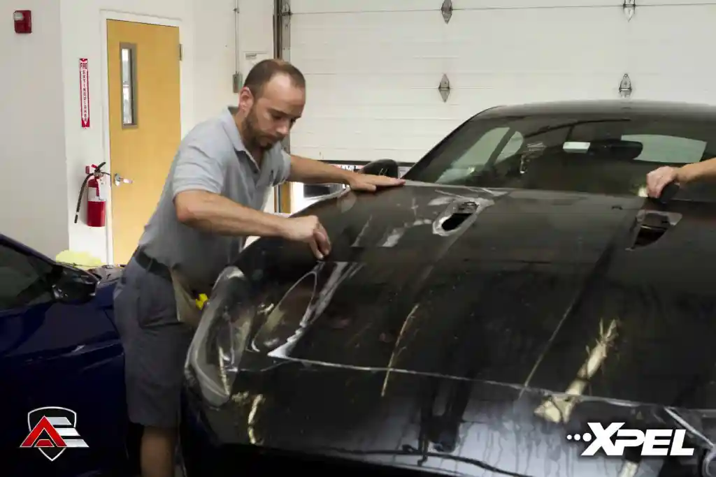 Paint protection film installation in progress on a Jaguar F-TYPE R hood