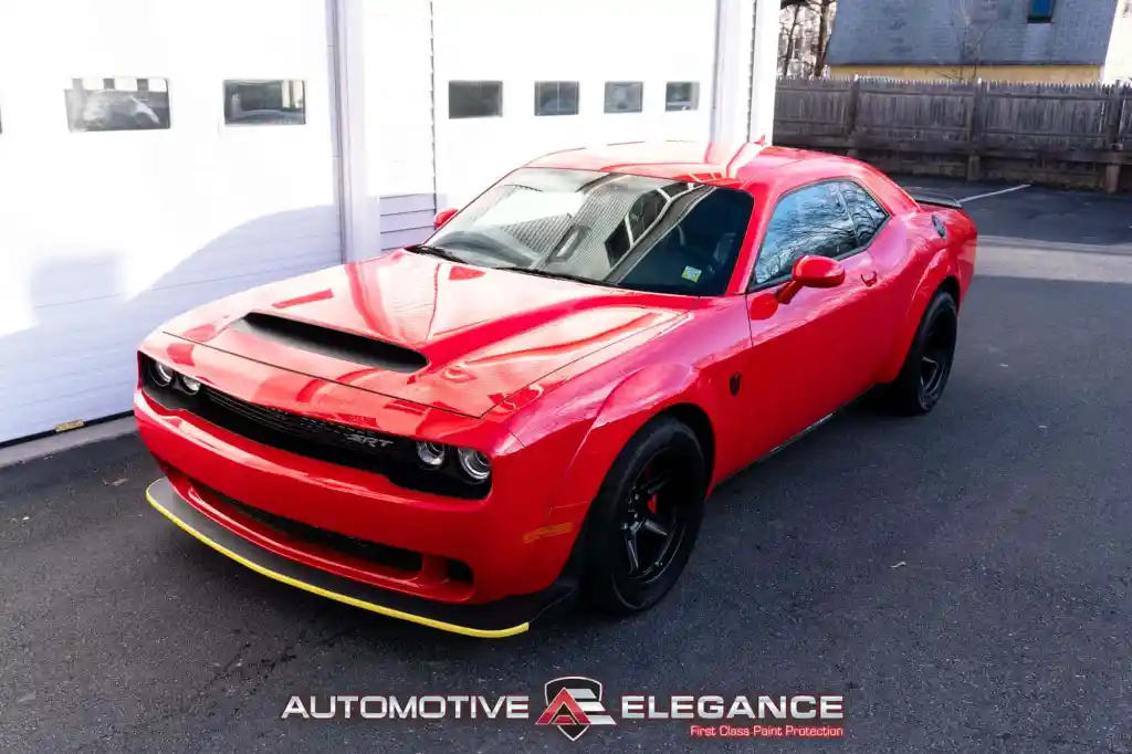 Red Dodge Challenger SRT Demon parked outside after paint protection film installation